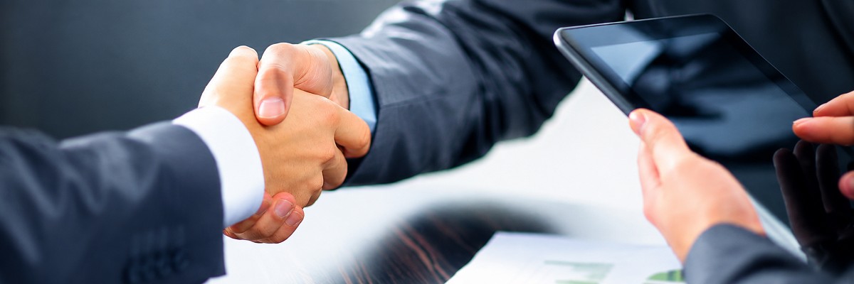 Business handshake representing the FNP Venues franchise opportunity