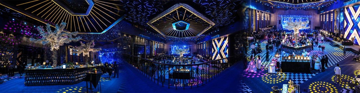 Engagement ceremony stage with elegant blue lighting and decor at an FNP Venues venue