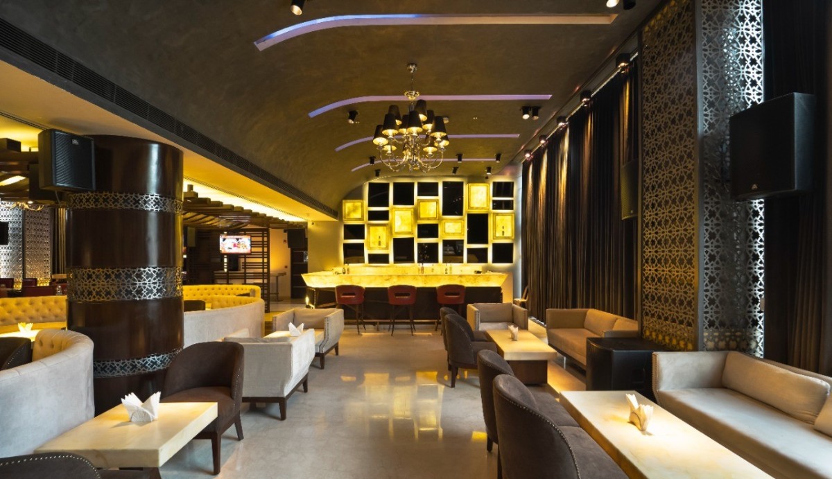 Udman Hotel hall with dark ceiling and elegant lighting