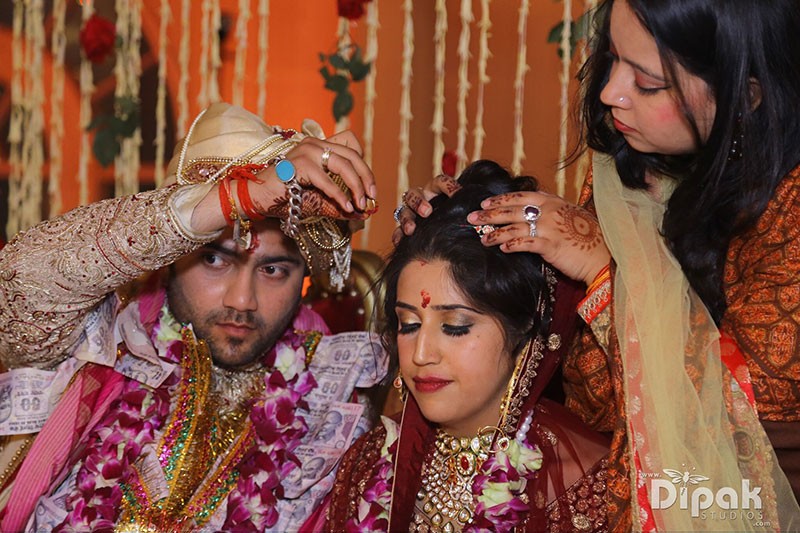 Rachit and Garima in festive traditional attire at their FNP Venues real wedding