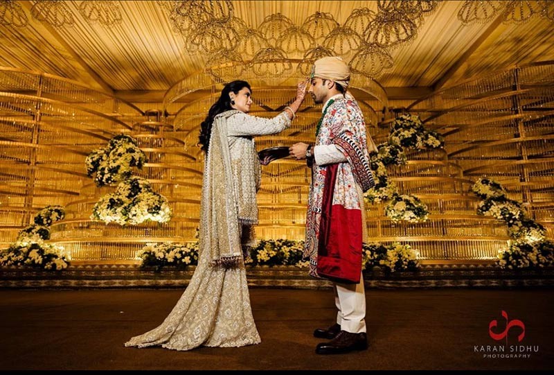 Bride and groom celebrating with guests at the wedding