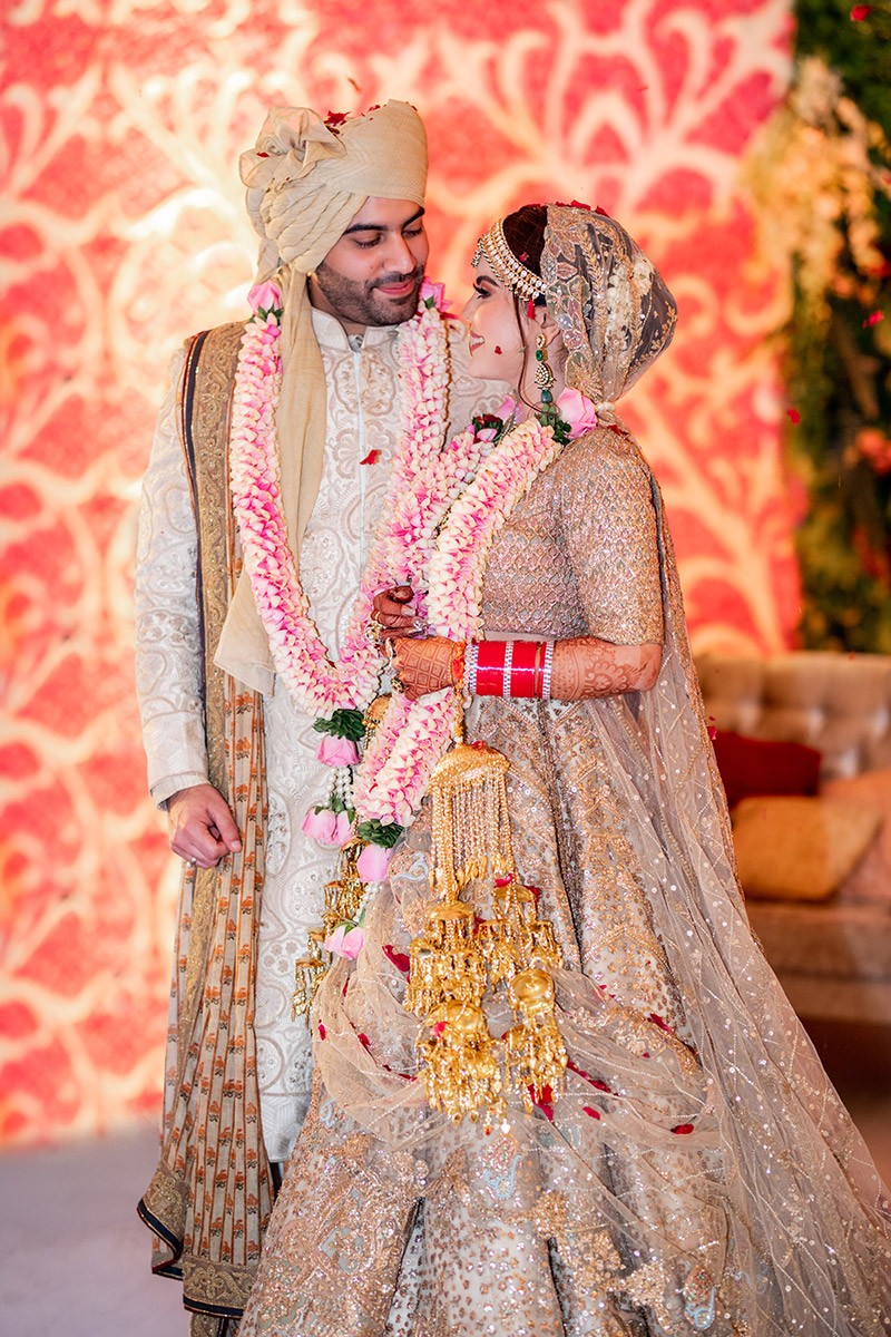 Bride Neha in traditional bridal attire at her wedding