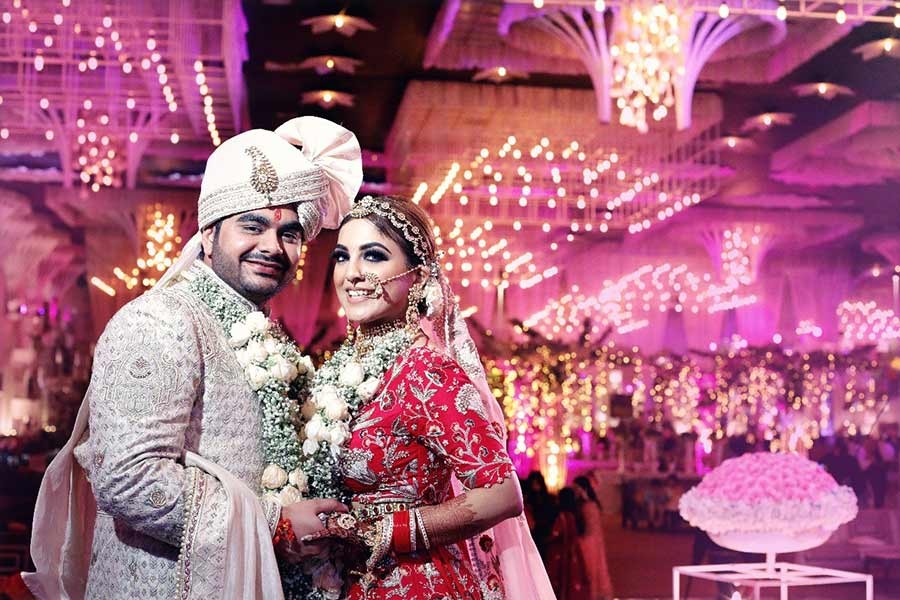 Saurabh and Gargi amid pink floral decor during their wedding celebration