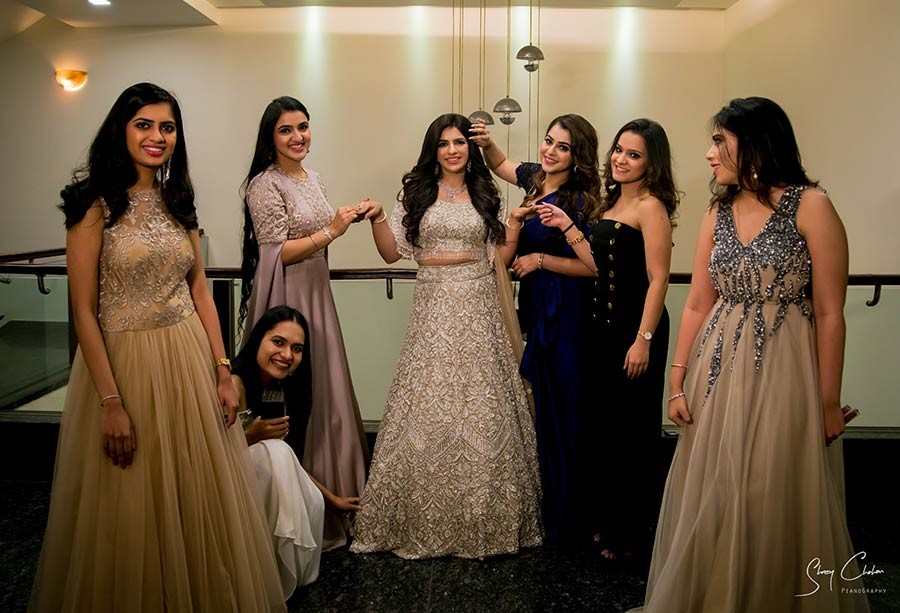 Group of women in blue outfits walking together at the wedding