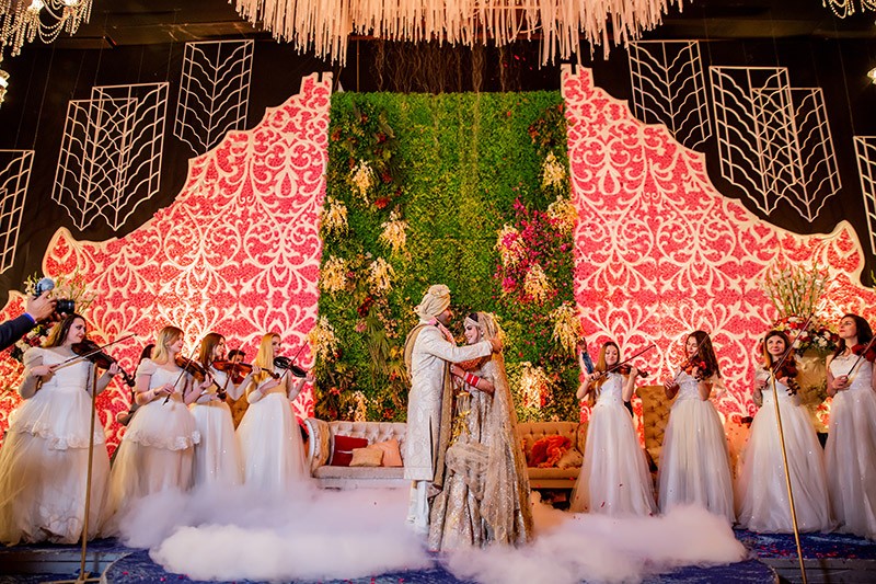 Decorated wedding stage adorned with lights at Neha and Pawan's wedding