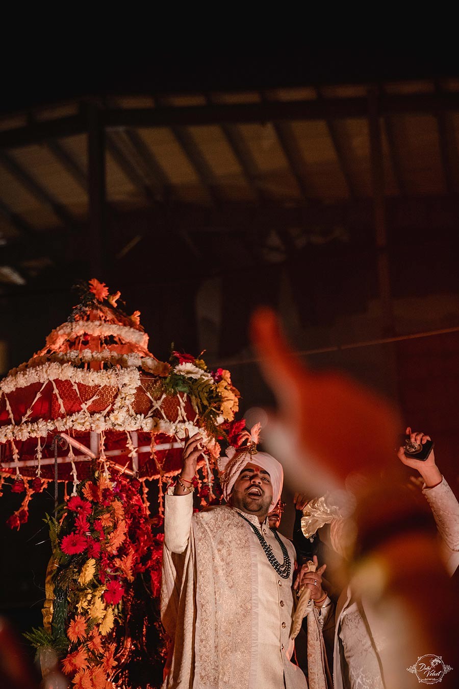 Warmly lit wedding ceremony scene at Prakriti and Sahil's celebration
