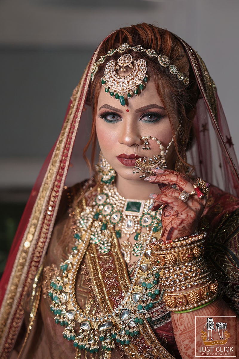 Close-up portrait of bride wearing ornate jewellery
