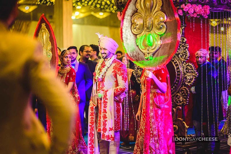 Family members celebrating together wearing colourful garlands
