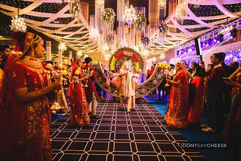 Guests celebrating together under colourful party lights