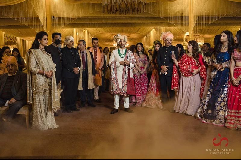 Group photo of the wedding party celebrating together