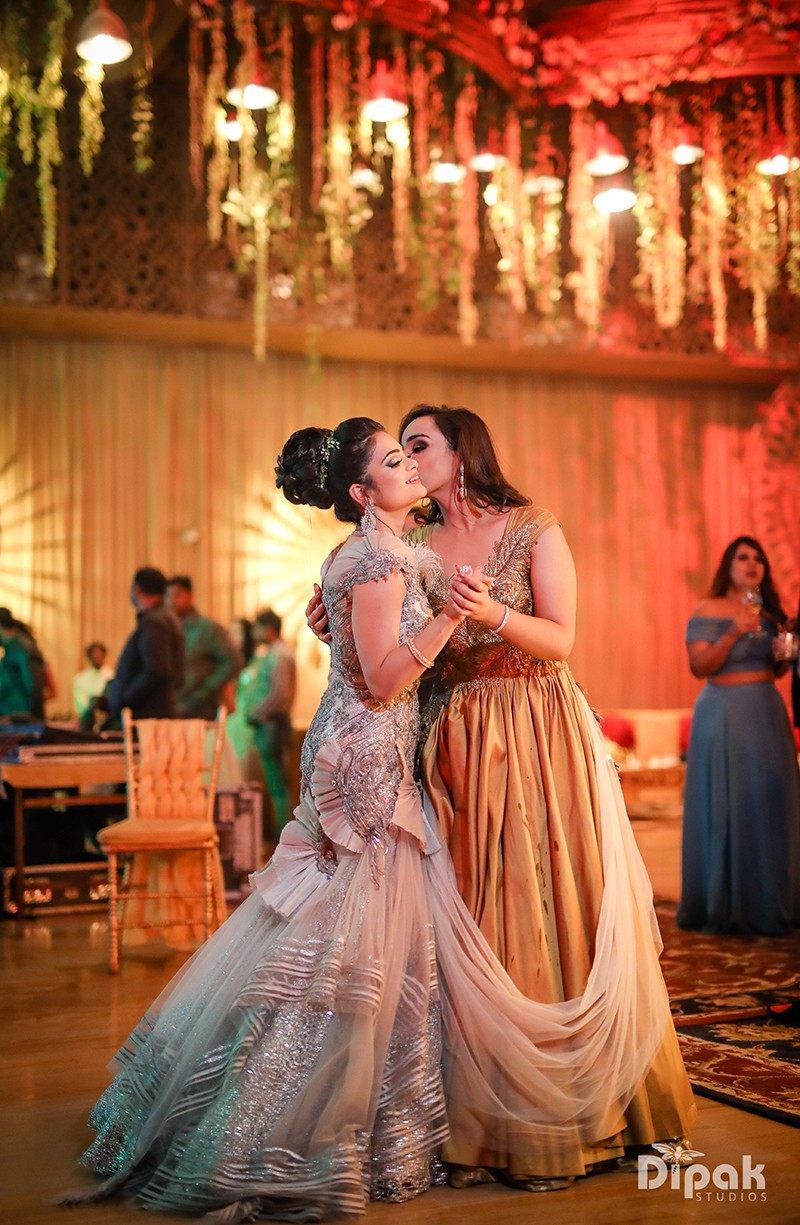 Ria and Manyu during a warmly lit wedding ceremony moment