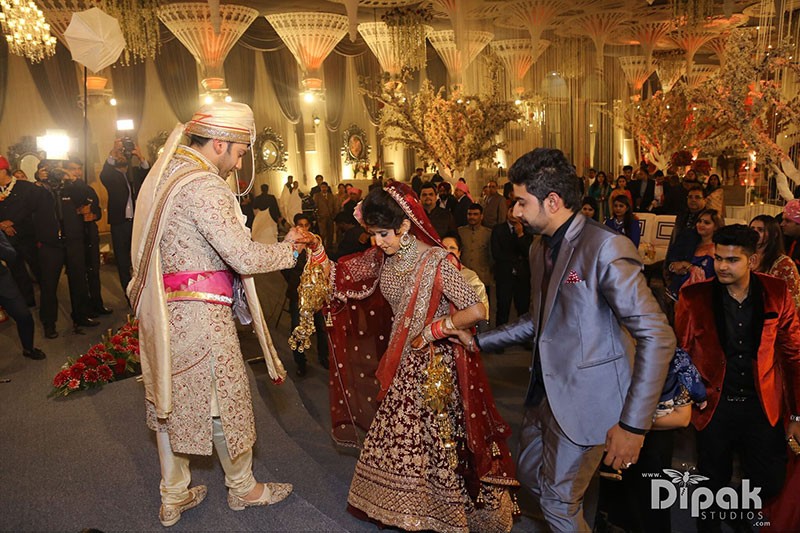 Rachit and Garima with guests during their wedding ceremony