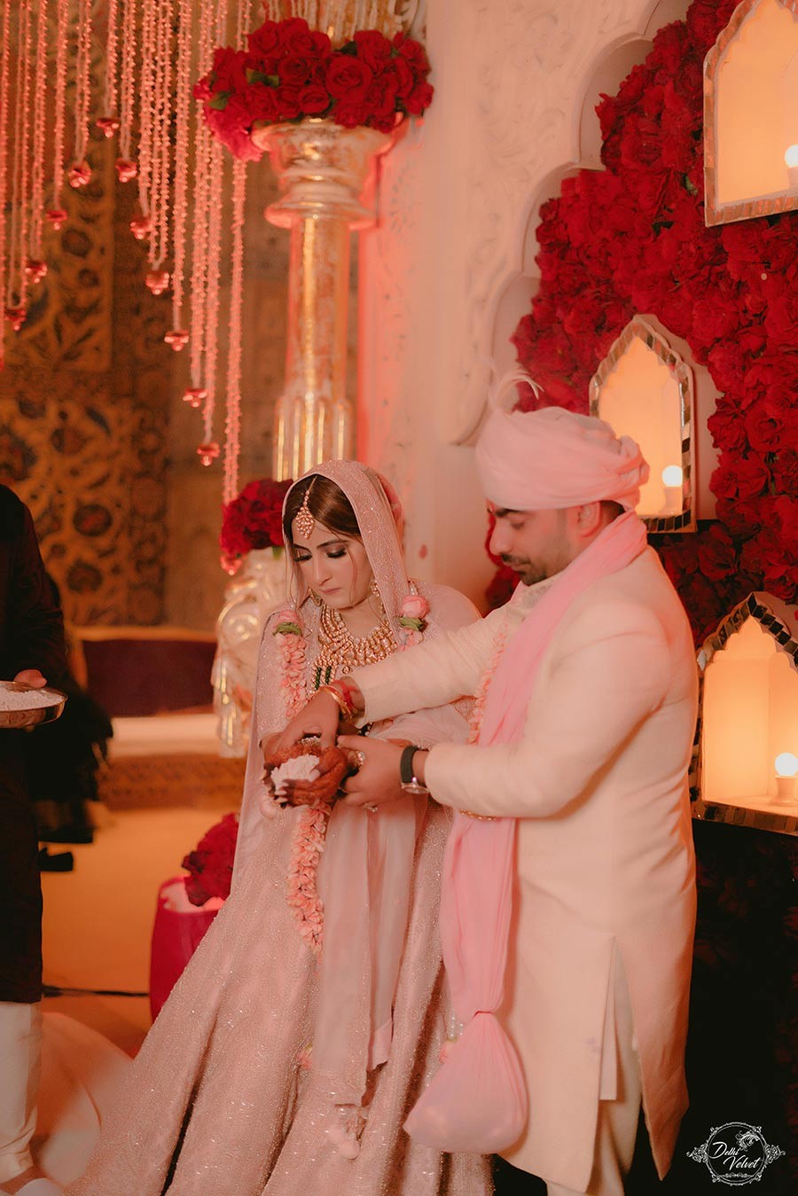 Prakriti and Sahil sharing an intimate moment in warm lighting at their wedding
