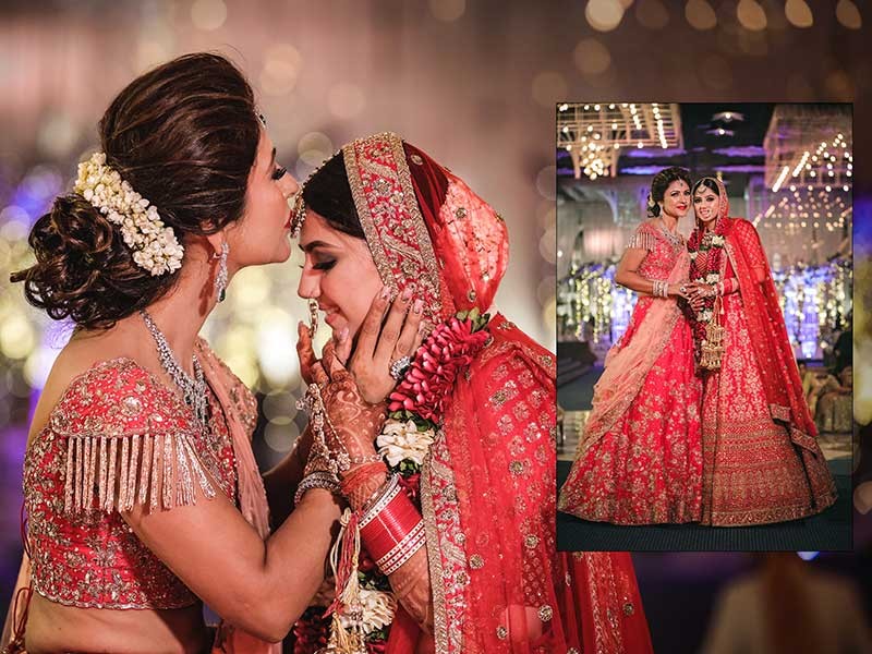 Priyansh and Priyanka embracing amid pink festive lighting at their wedding