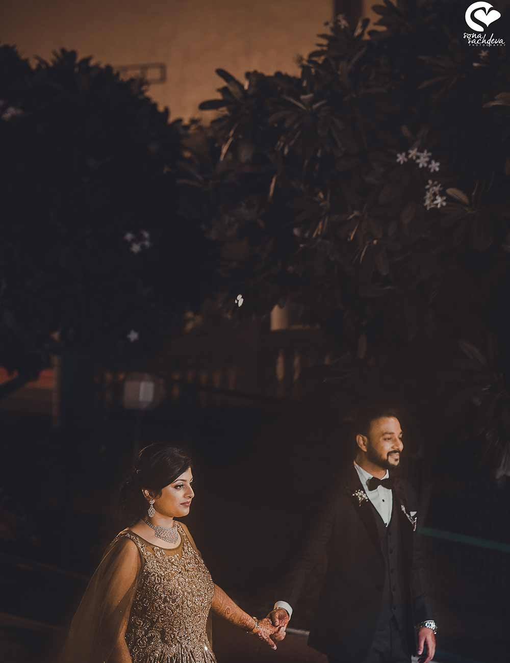 Sparklers and festive night lighting illuminating a celebratory moment at Deepanshu and Sonali's wedding