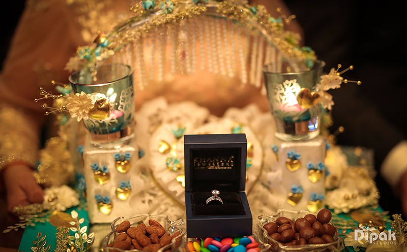Decorated wedding entrance adorned with lights at Ria and Manyu's celebration