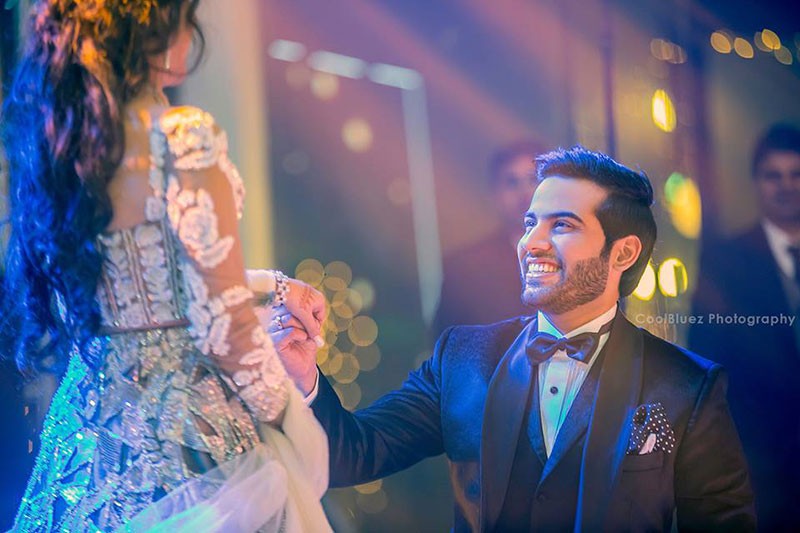 Neha and Pawan at their reception amid festive lighting