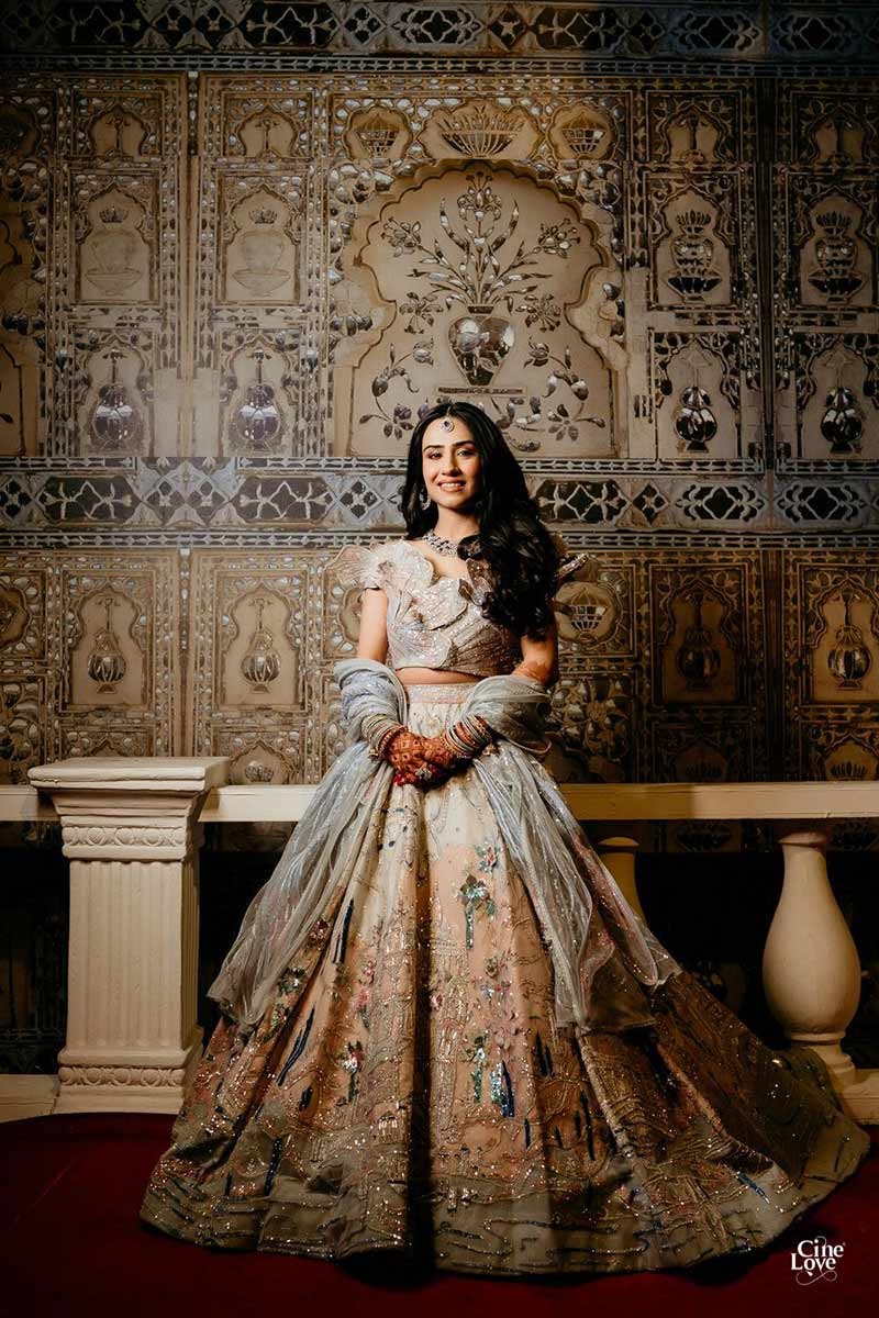 Close-up portrait of bride in a gold embellished outfit