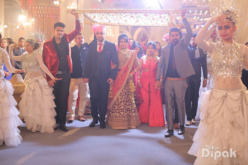 Rachit and Garima with family at their wedding celebration
