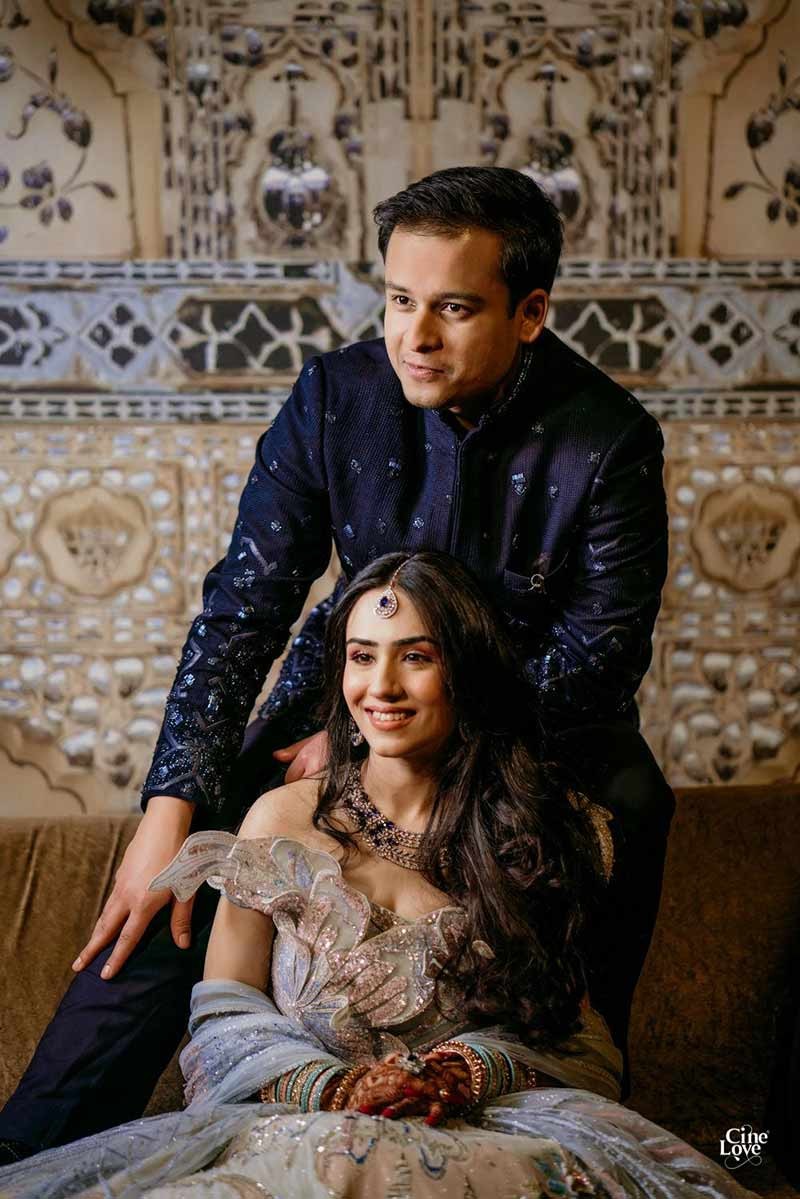 Close-up of bride and groom together in formal dark attire