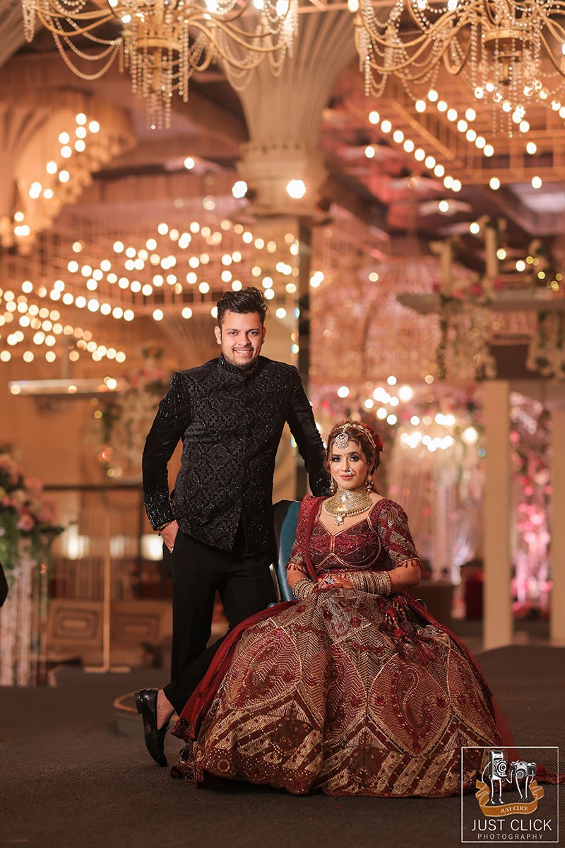 Bride and groom standing together at the decorated venue