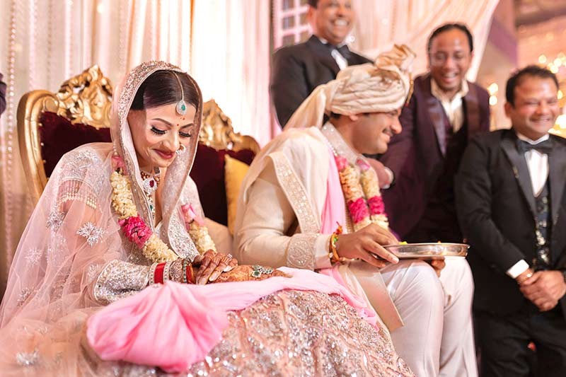 Bride and groom celebrating together amid floral decor