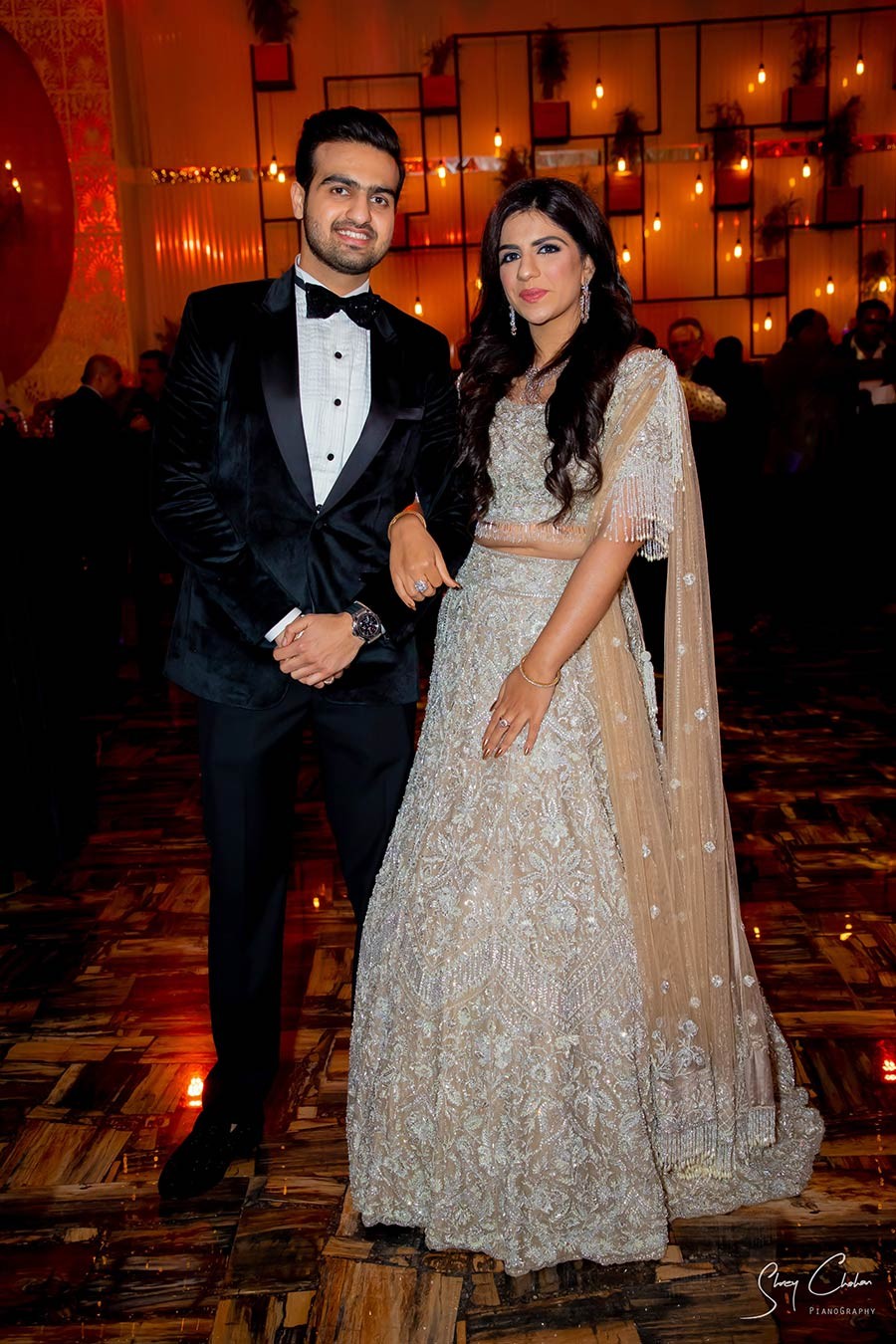 Bride Vrinda in a white gown with Mohit during their wedding celebration