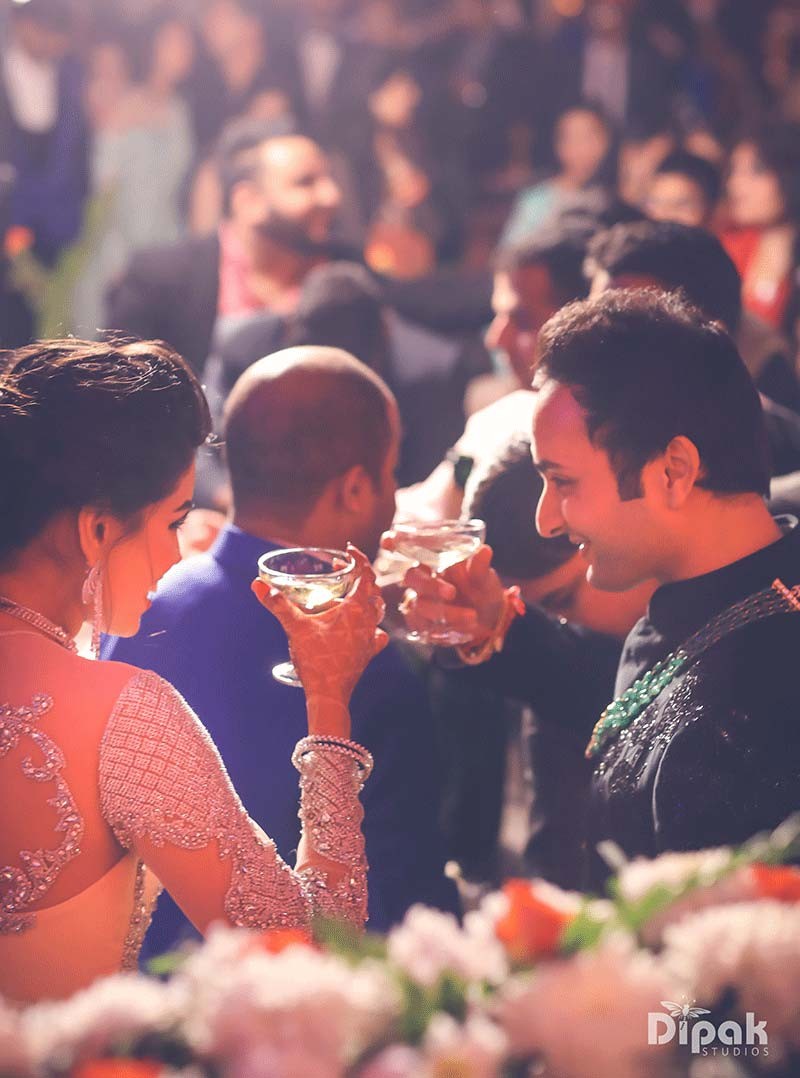Shreejeet and Tanvi sharing an intimate dance in warm lighting