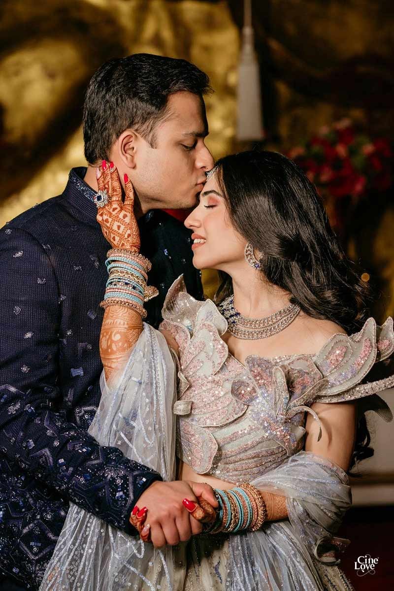 Close-up of bride and groom embracing