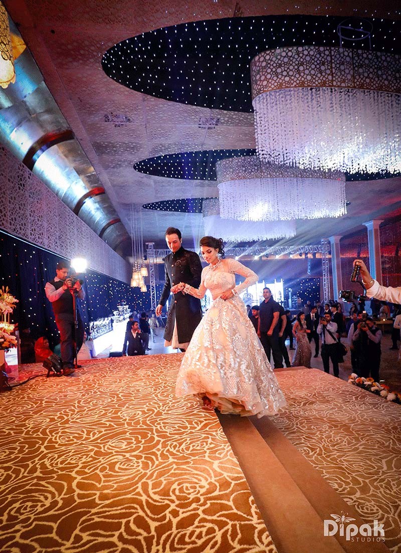 Elaborately lit reception stage at Shreejeet and Tanvi's wedding venue