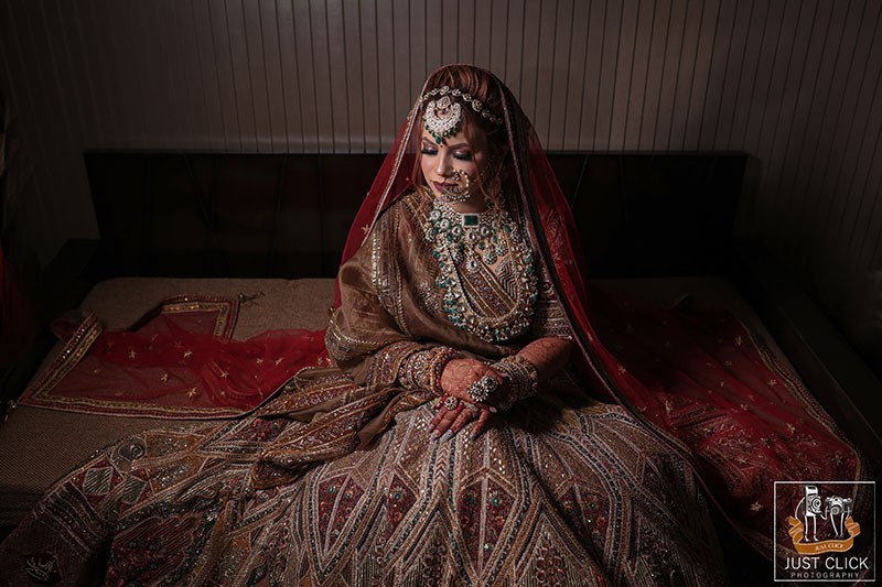 Close-up portrait of the bride against a dark background