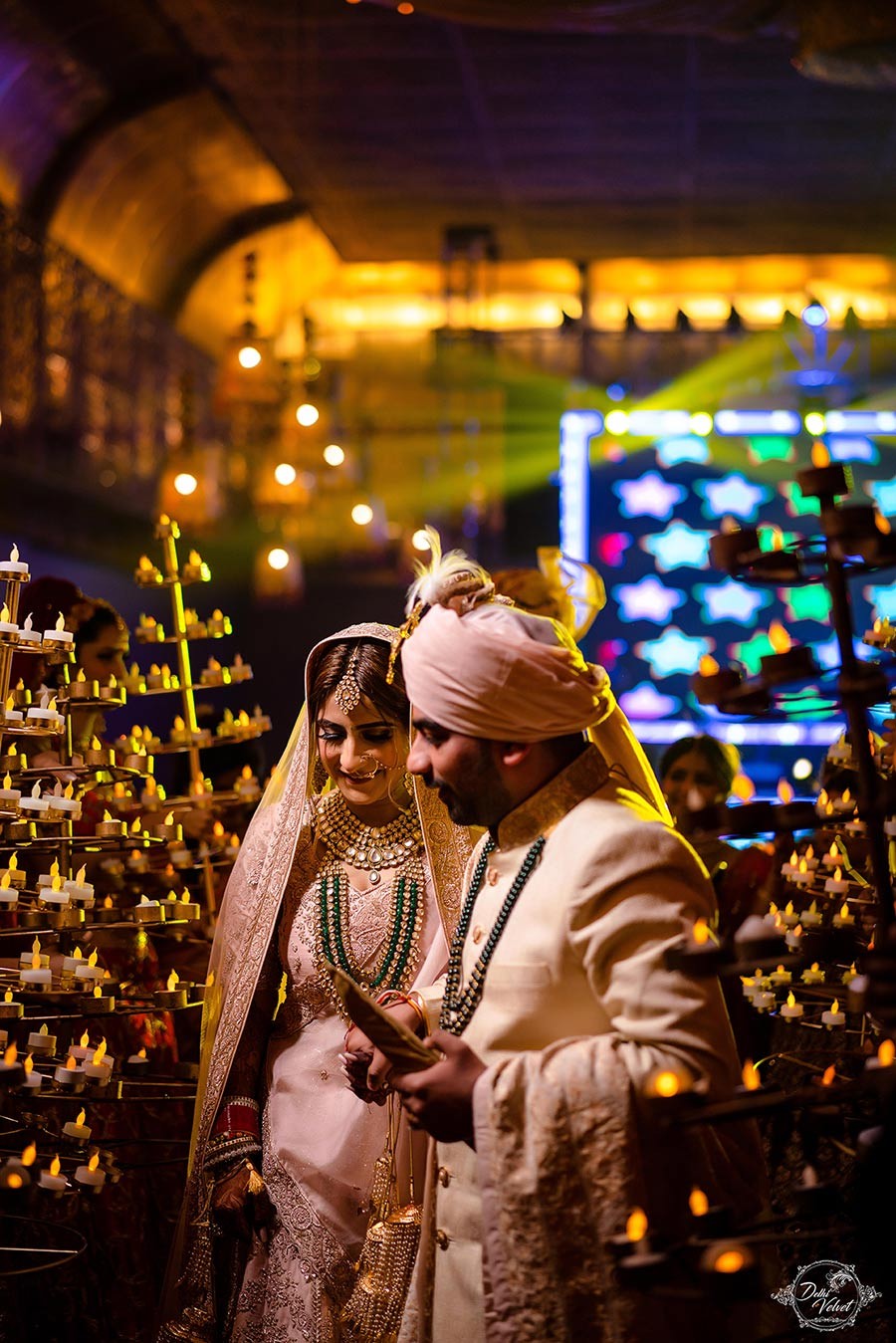 Prakriti and Sahil amid sparkling festive lights during their wedding celebration