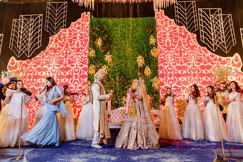 Neha and Pawan with guests during their wedding ceremony