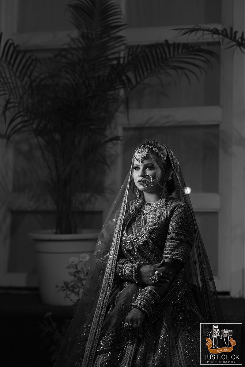 Close-up portrait of the bride against a dark background