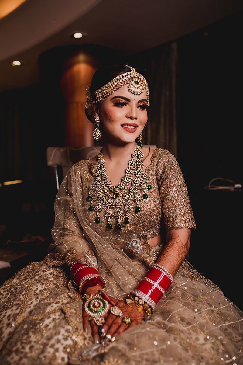 Bride Neha in ornate traditional bridal attire
