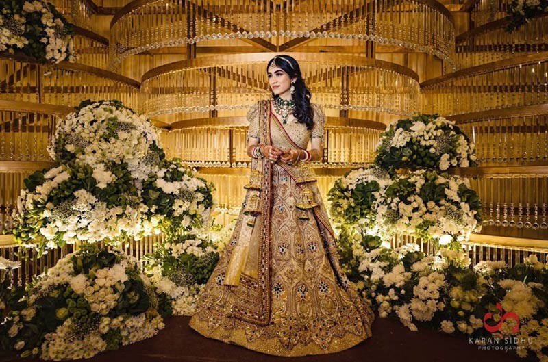 Bride posing solo in traditional wedding attire