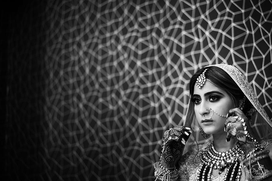 Black and white portrait of bride Prakriti in traditional bridal attire at her wedding