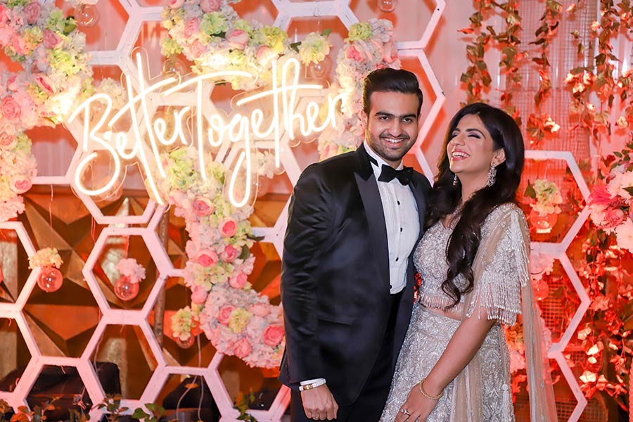 Vrinda and Mohit amid festive marigold decor during their wedding celebration
