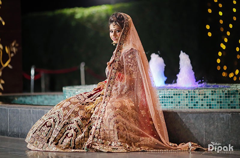 Bride Anjali in a gown amid sparkling lights at her reception