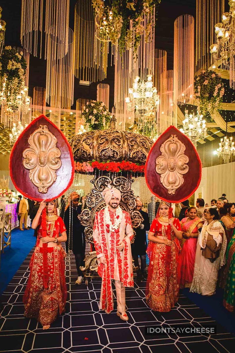 Family members celebrating together wearing colourful garlands