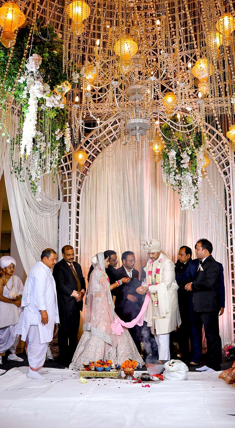 Wide view of the couple at the decorated wedding venue