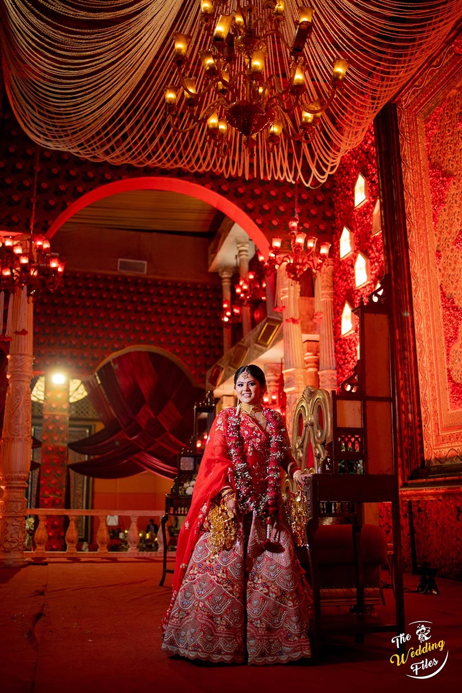 Festive red and gold decor detail at Sanya and Anish's wedding ceremony