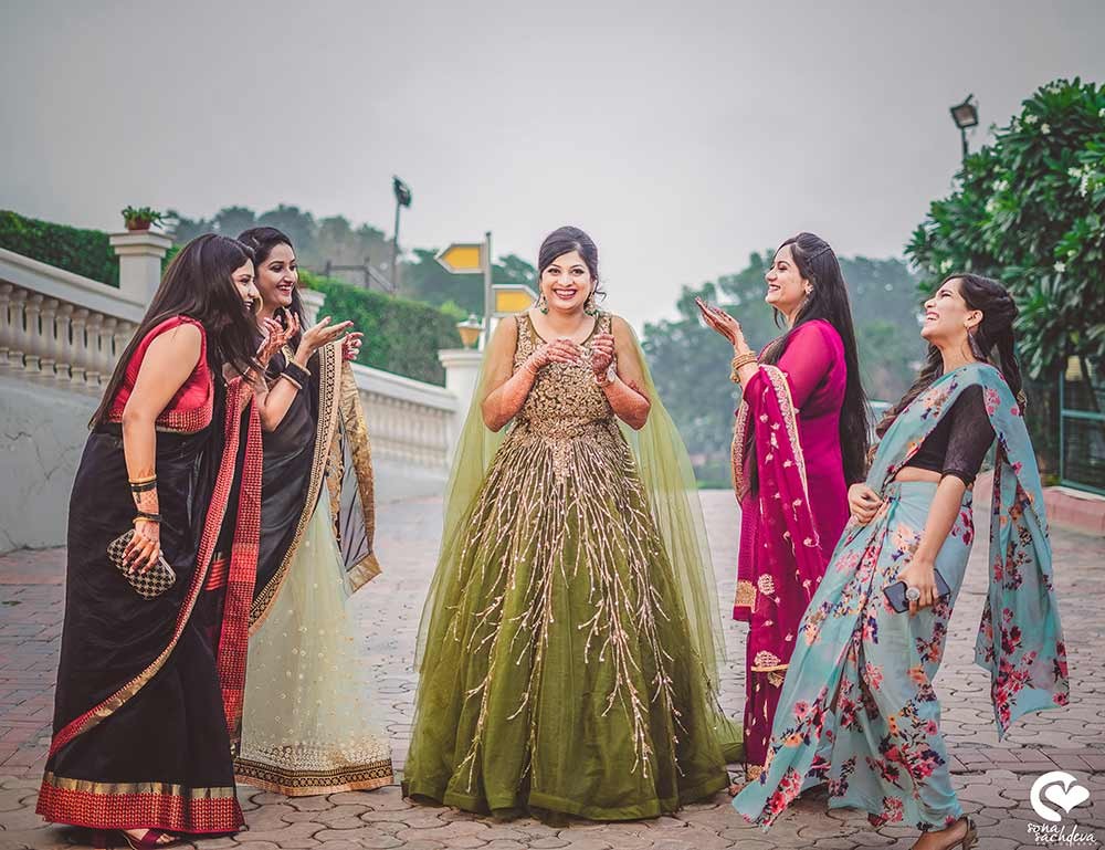 Deepanshu and Sonali celebrating amid festive decor at their wedding