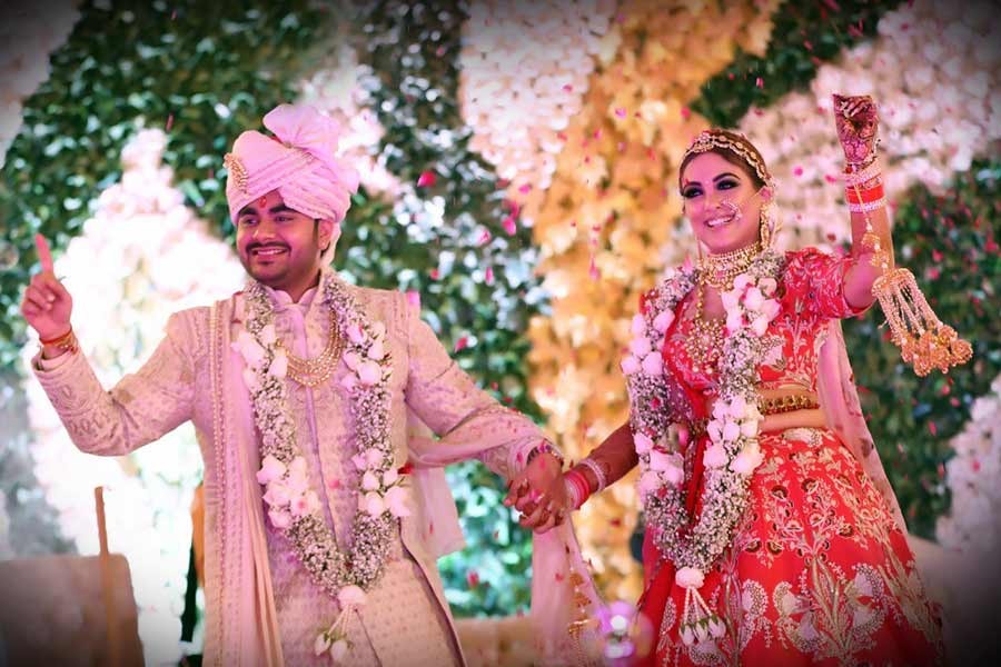 Saurabh and Gargi surrounded by floral decor during their wedding