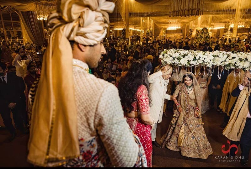 Bride and groom performing a wedding ritual together