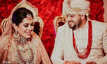 Sanchit and Aanchal posing together as a couple during their wedding