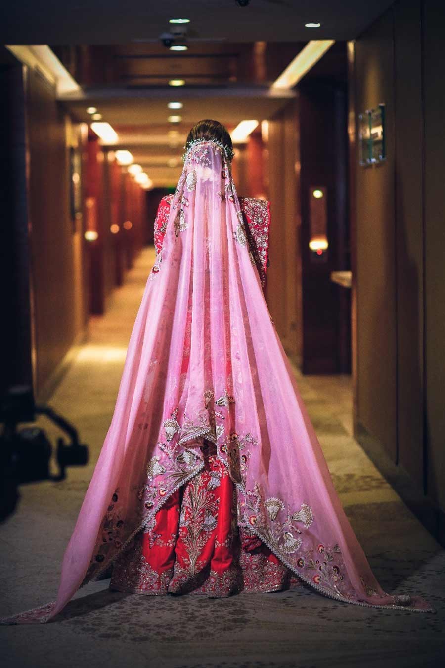 Bride Gargi in a pink lehenga during her wedding to Saurabh