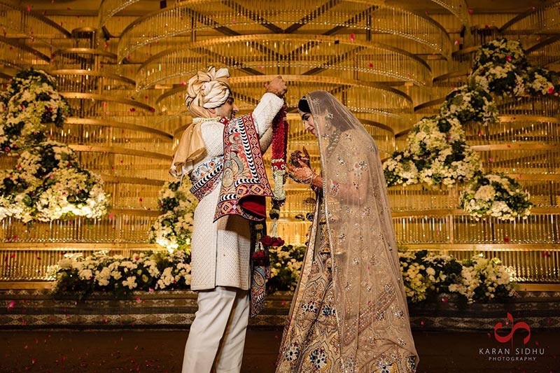 Bride and groom posing together at the wedding venue