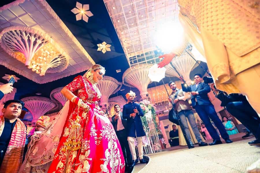 Guests gathered in bright sunlight at Saurabh and Gargi's wedding celebration