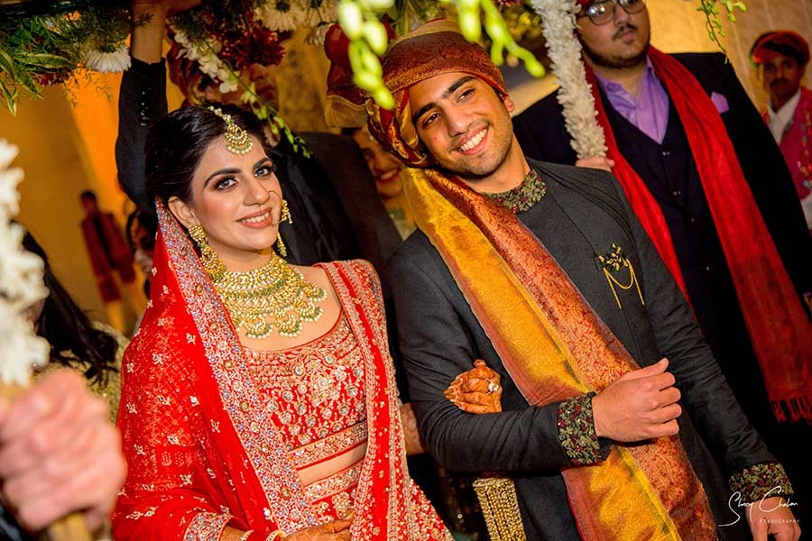Close-up of bride in red bridal attire with traditional jewellery